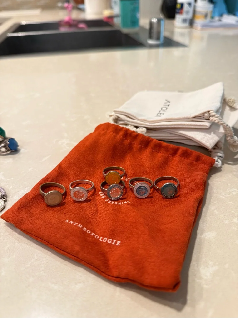 Anthropologie Stackable Coin Rings Set — Orange, Yellow, Blue, Gray